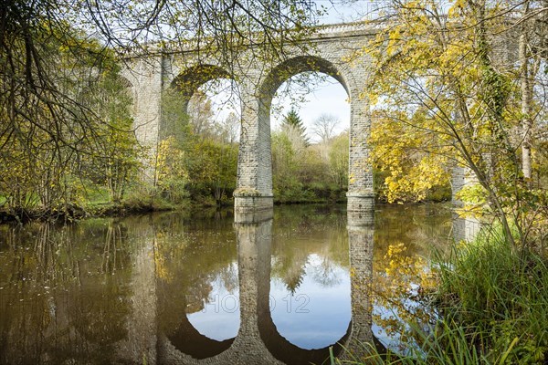 Viaduct at Glénic in late autum reflected in Creuse river