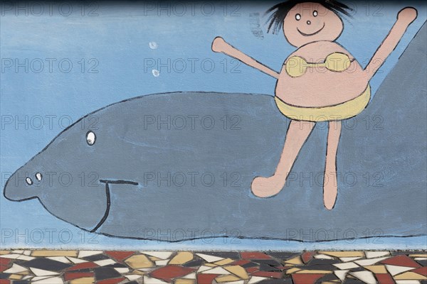 Girl riding on a shark