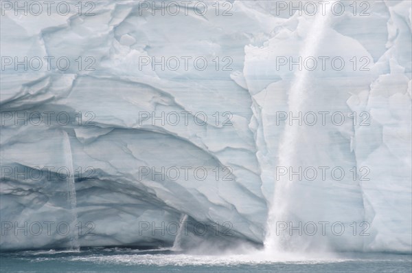 Meltwater waterfalls at the glacier front of Bråsvellbreen