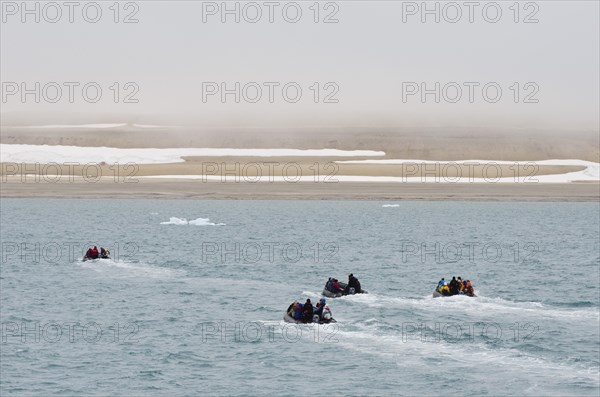 Zodiac inflatable boats transporting passengers from an expedition cruise to the shore