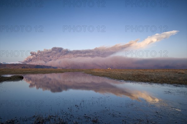 Ash cloud from the Eyjafjallajoekull volcano at sunset