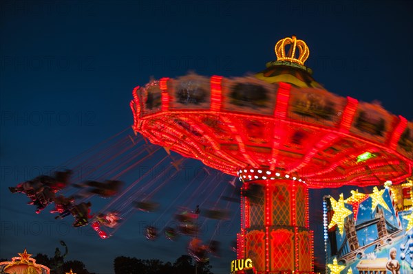 Chair-o-plane or wave swinger at night