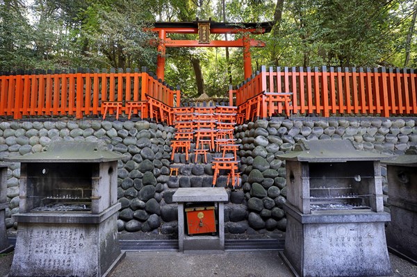 Torii at a sacred place in the forest