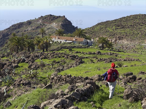 Woman hiking on the Lomo de Sabinilla