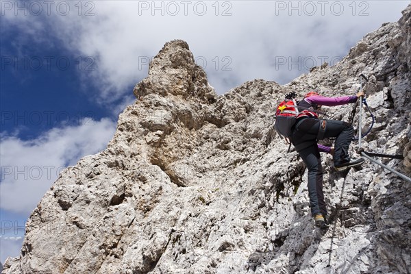 Mountain climber during the ascent of Kesselkogel Mountain in the Rosengarten Group