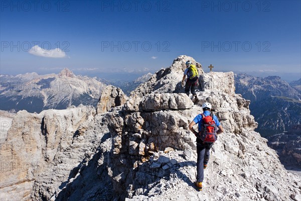 Mountain climbers decending along the Via Ferrata Marino Bianchi climbing route on Mount Cristallo