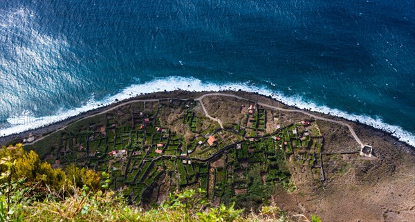 Terraces at the cliffs of Santa Maria Madalena at the foot of Mount Cabo Girao at Achadas da Cruz