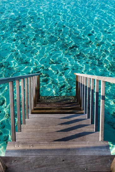 Steps leading into blue water