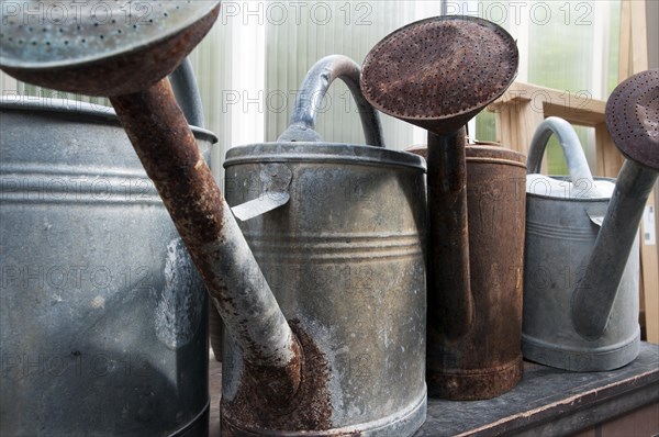 Watering cans made of galvanized sheet metal