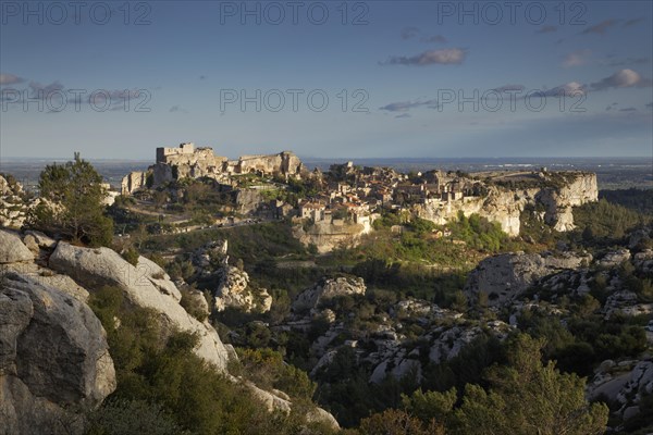 Castle ruins above the village in the evening light