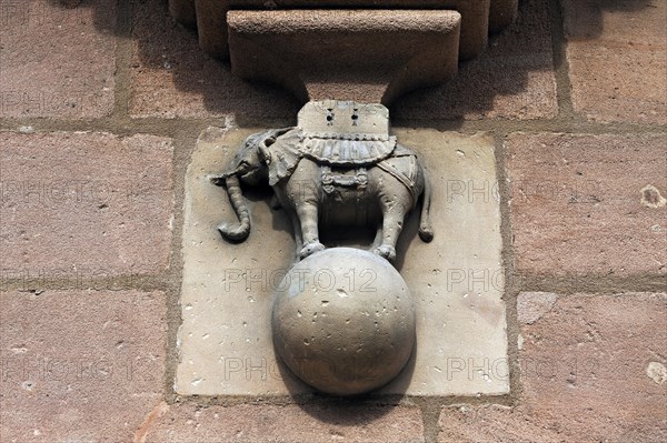 Elephant standing on a globe under the bay window on the facade of Tucher Mansion