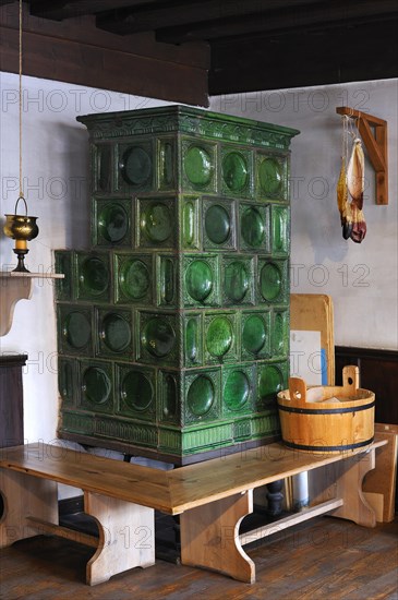 Historic tiled stove with oven bench