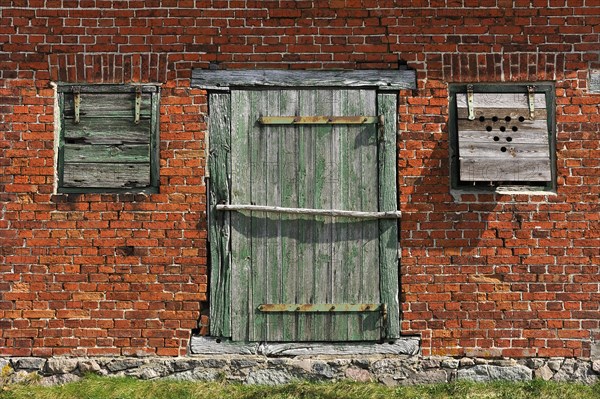 Door and window flaps of an old barn