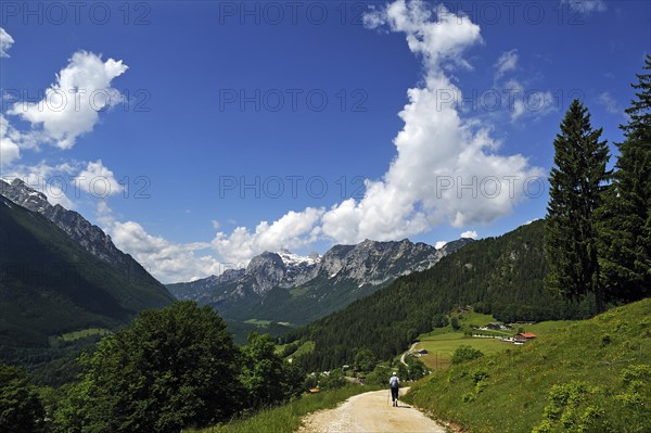 Berchtesgaden Alps with a hiker walking along a hiking trail