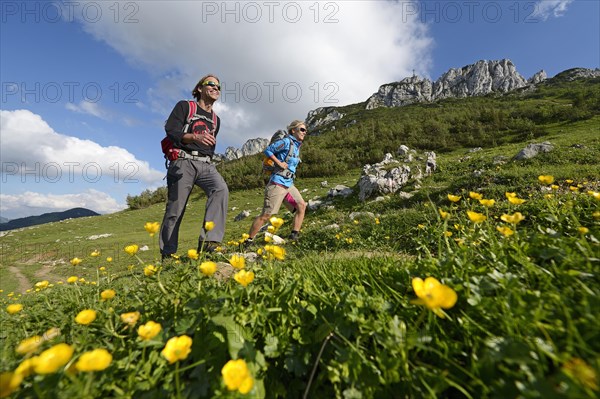 Hikers in front of Kampenwand Mountain