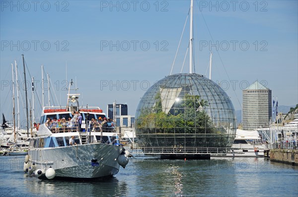 Excursion boat in front of the glass sphere "Biosfera"