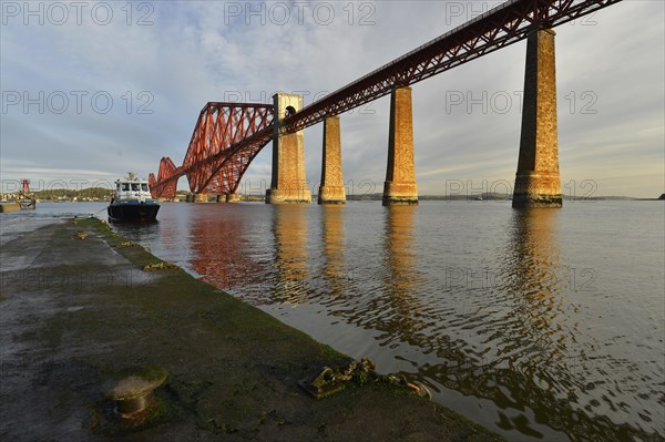 Jetty next to Forth Bridge railway bridge across Firth of Forth