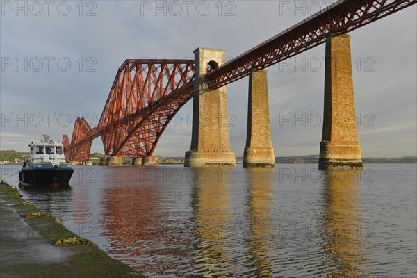 Boat jetty next to Forth Bridge railway bridge across Firth of Forth