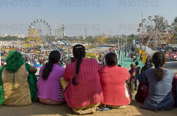Indian women watching a fun fair