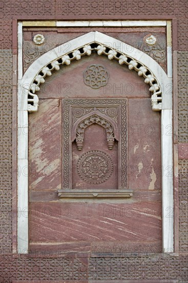 Decorative elements carved in sandstone and marble