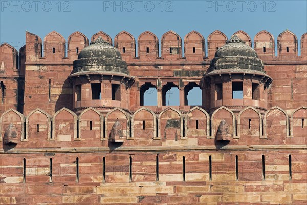 Fortified outer walls with battlements and loopholes