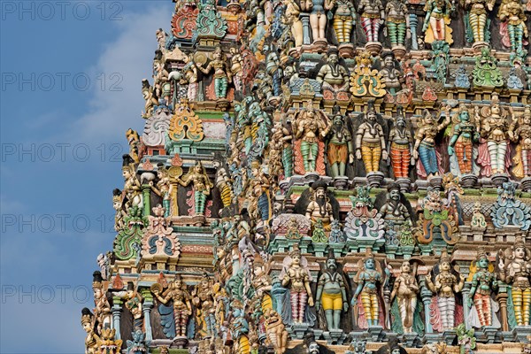 Colourful statues of gods and demons on the Gopuram or Gopura gate tower