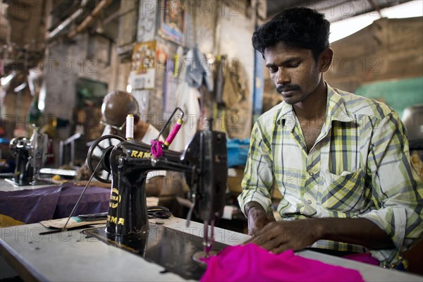 Tailor in a former building of Meenakshi Amman Temple or Sri Meenakshi Sundareswarar Temple