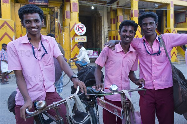 Students in school uniforms standing in front of the entrance to the Ramanathaswami Temple