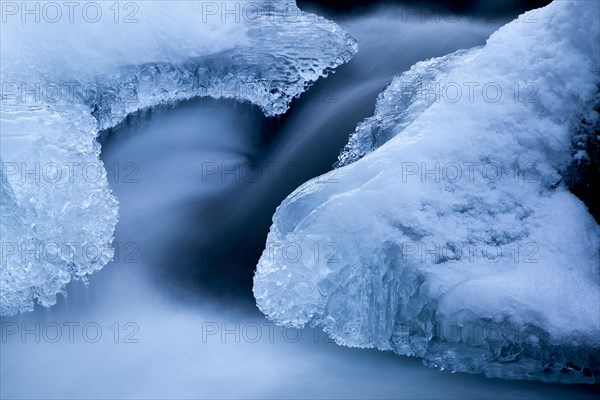 Ice formations in a mountain stream in winter
