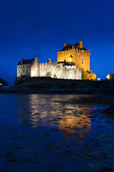 Eilean Donan Castle illuminated at dusk