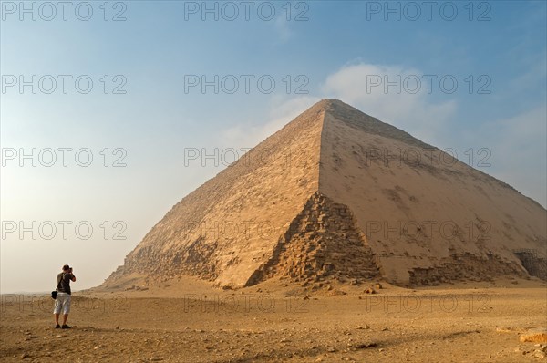 Tourist takes pictures of Sneferu's Bent Pyramid