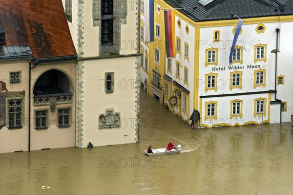 Lifeboat from the Wasserwacht lifeguards in front of the Town Hall with the flood waters covering the historical flood level indicator