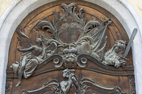 Carved relief image on the wooden portal