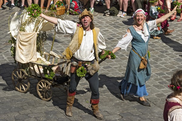 Impoverished couple pulling a baby carriage