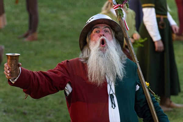 Bailiff holding a cup wearing a medieval costume at the showgrounds