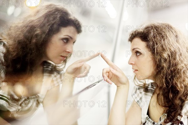 Woman and her mirror image