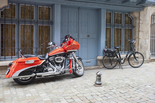 Harley Davidson motorcycle and a bicycle with saddlebags