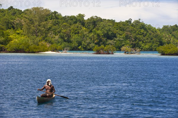 Man paddling in his canoe