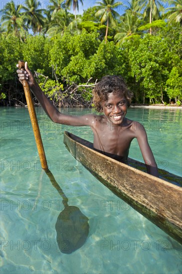 Local boy in a canoe in the Marovo Lagoon