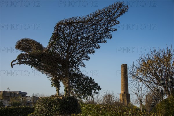 Eagle sculpture in front of Sheik Chooli minaret in Shanadar Park