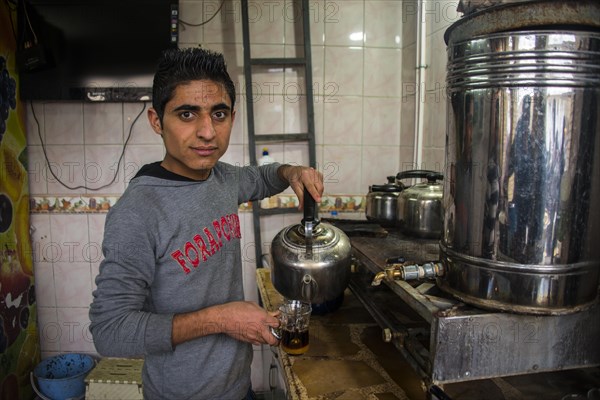 Boy selling tea