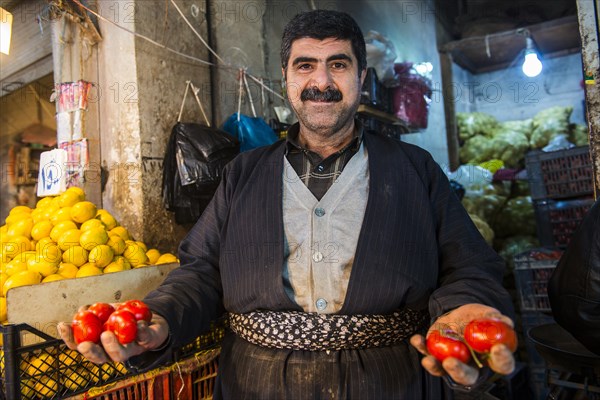 Vendor selling tomatoes in the bazaar of Sulaymaniyah