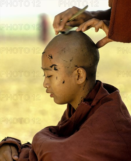 Novice having his hair shaved