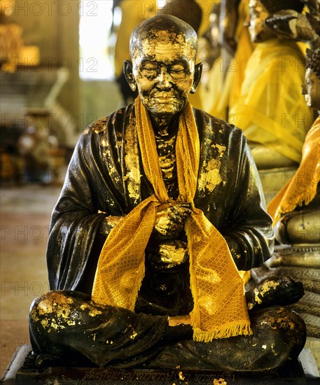 Gilded monk statue in the mountain temple of Wat Phra That Doi Tung