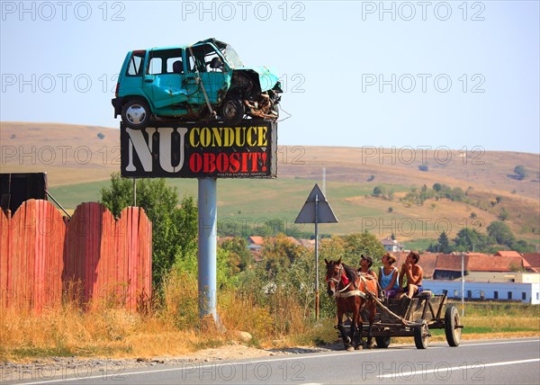 Horse-drawn carriage in traffic