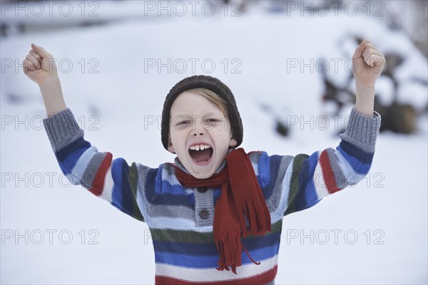 Boy in a winter sweater and a scarf