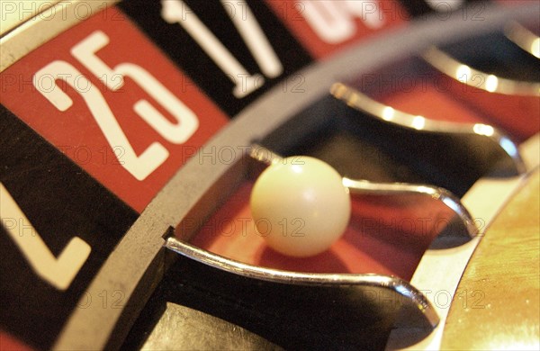 Detail of a roulette wheel with the ball on the number 25