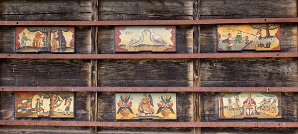 Artistically painted front boards on a beehive