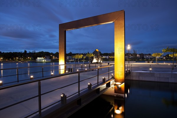 Illuminated promenade with the Thomas Smelting Furnace on Kulturinsel