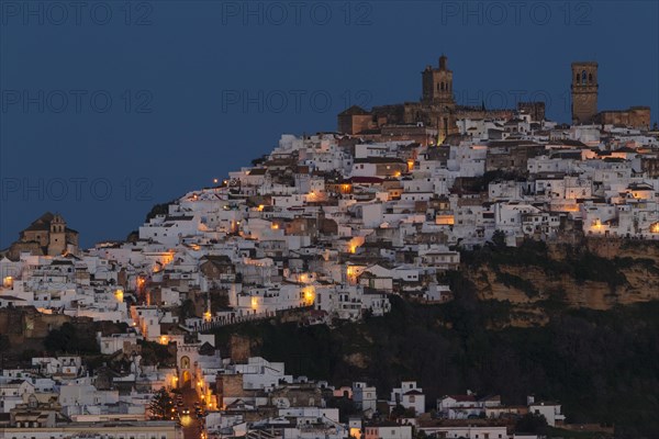 Whitewashed village of Arcos de la Frontera on a limestone rock at dawn